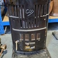 Art deco kolen- of houtkachel van gegoten ijzer en emaille a – kavel bij BOPA Auctions, Aarsele